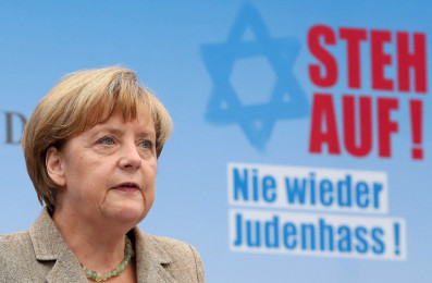 BERLIN, GERMANY - SEPTEMBER 14:  German Chancellor Angela Merkel speaks at a rally against antisemitism on September 14, 2014 in Berlin, Germany. With the slogan 'Stand Up! Never Again Hatred Towards Jews' ('Steh auf! Nie wieder Judenhass'), the Central Council of Jews in Germany (Zentralrat der Juden) organized the demonstration after antisemitic incidents in the country occurring in the wake of the conflict in Gaza this summer, in which more than 2,000 Palestinians were killed by the Israeli government, the majority of whom were civilians, according to Palestinian authorities.  (Photo by Adam Berry/Getty Images)