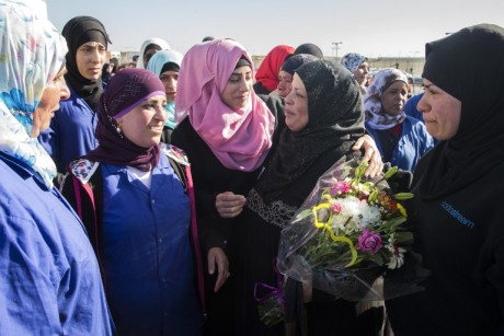 Arab-Israeli women greet a colleague (2ndR) being one of the last Palestinian employees of the Israeli SodaStream drinks firm leaving after they were laid off following a work permit battle on February 29, 2016 before they leave SodaStream's plant in the Israeli city of Rahat in the Negev desert. The company lashed out at the government for refusing to grant them work permits after it relocated from the West Bank to southern Israel. The company, which manufactures a device for making fizzy drinks at home, announced in late 2014 it was closing the West Bank plant following a boycott campaign that included targeting Hollywood actress Scarlett Johansson after she advertised its product. The plant, located in a Jewish settlement, closed in October last year, with more than 500 Palestinians made redundant, and then relocated inside Israel. / AFP / JACK GUEZ