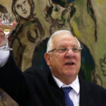 Rivlin raises his glass in a toast during his speech after he was elected Israel’s president at the Knesset in Jerusalem