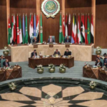 membri della lega araba seduti in riunione